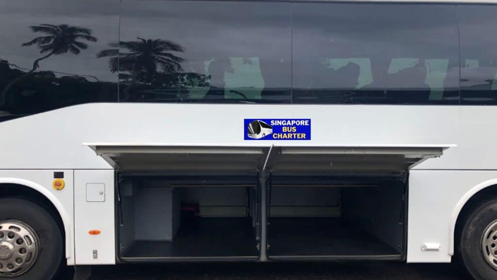 luggage being loaded into a 45-seater coach hold